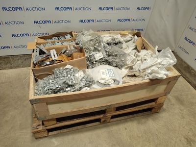 a wooden crate filled with assorted metal items on the floor