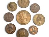 several different types of coins are arranged in a circle
