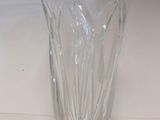 a glass vase that is sitting on a table