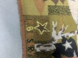 a close up of a piece of fabric with a cat on it