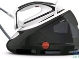 an image of a black and white steam iron on a white background