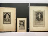 three framed portraits of men and women in black frames on a wall