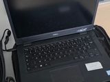 two laptops that are sitting on top of each other
