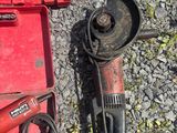 a red box with tools on the ground next to it