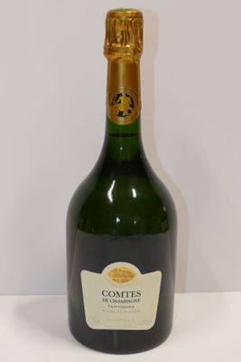 a bottle of wine that is sitting on a table