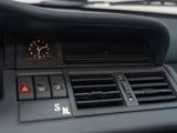 a clock on the dashboard of a car in the car