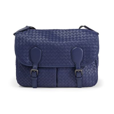 a blue leather messenger bag with two buckles on the front