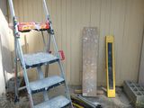 a ladder that is leaning against a building
