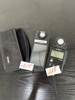 two remotes sitting next to each other on a table