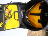 a yellow and black backpack with a yellow handle