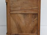 a small wooden table with a drawer on it
