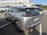 a silver car that is parked in a parking lot