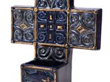 a blue and gold cross shaped box on a white background