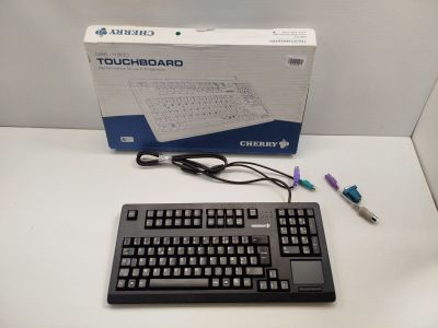 a computer keyboard and mouse sitting on a table