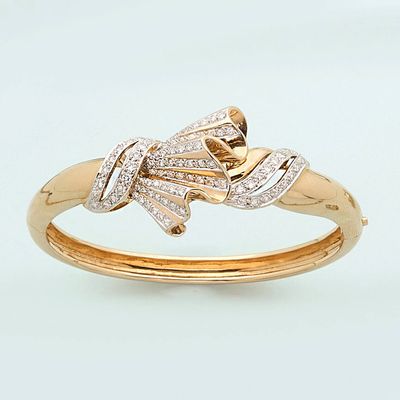 a close up of a gold ring with diamonds on it