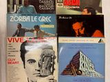 quatre vinyles LP contenant des morceaux variés des années 1970