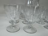 several empty wine glasses sitting on top of a white table