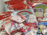 many bags of birthday cards and other items on the table
