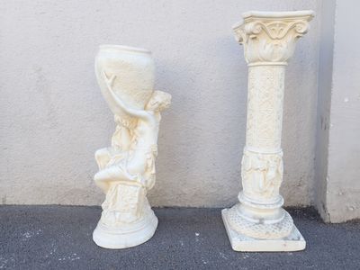 two vases sitting next to each other on the sidewalk