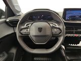 the interior of a car with a steering wheel, dashboard, and display screen