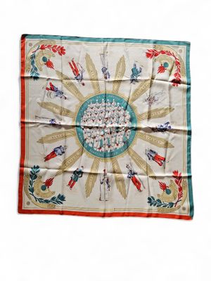 an image of a square scarf with a picture of people on it