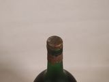 a bottle of wine that is sitting on a table