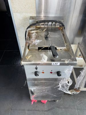 an image of a commercial fryer sitting on the floor