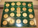 a picture of a picture of a set of gold coins