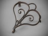 an image of a metal hook with a heart shaped design on it