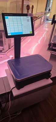 a tablet computer sitting on top of a table in a store