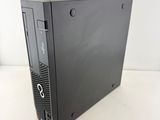 a close up of a black computer on a white surface