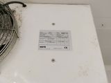 a fan that is sitting on top of a stove