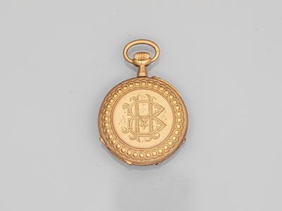 an image of a gold pocket watch on a white surface