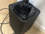 a video game controller sitting on top of a black box