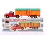 a red truck and a yellow truck in a box