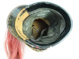 a close up of a hat with a red hair