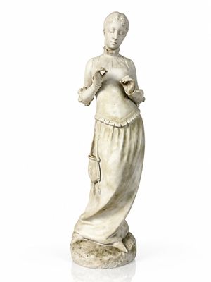 a statue of a woman holding a bird in her hands