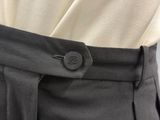 a close up of a person ' s pants with a button on it