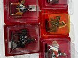 four different toy figures of a man riding a horse