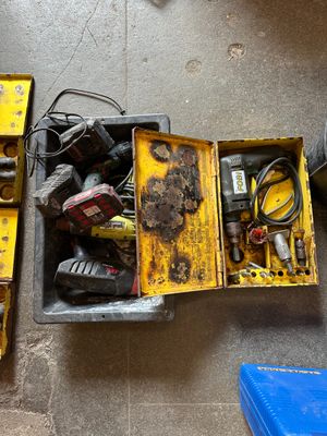 many tools that are sitting in a box on the floor