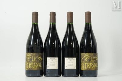 three bottles of wine are lined up on a table