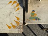 two pieces of art on the ground next to each other