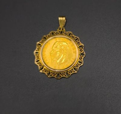 a close up of a gold coin on a black surface