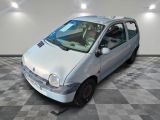a small silver car that is parked on a checkered floor