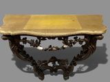 a small table with a marble top on a gray background