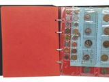 a red folder with coins inside of it on a white background