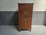 a wooden cabinet with a door on the top of it