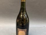a bottle of wine sitting on top of a table