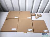 four cardboard boxes are stacked on top of each other on a table
