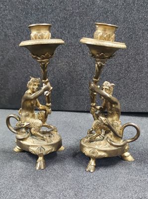pair of antique brass candlesticks with monkeys on them